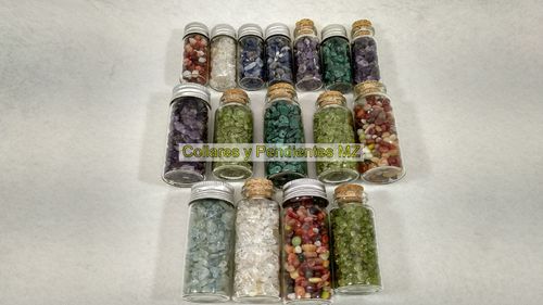 ROLLED STONES IN GLASS CONTAINERS